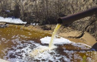 The Industrial Wastewater is Discharged from the Pipe